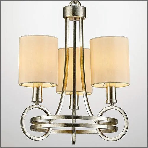 A Diyas IL31701 Isabella Pendant with a beige shade and three E14 lights is plated in antique silver.